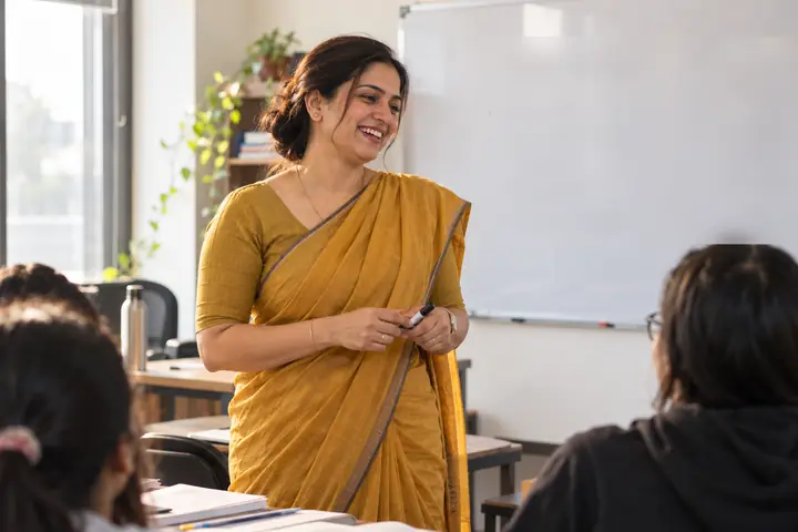 Teacher smiling in a coaching classroom