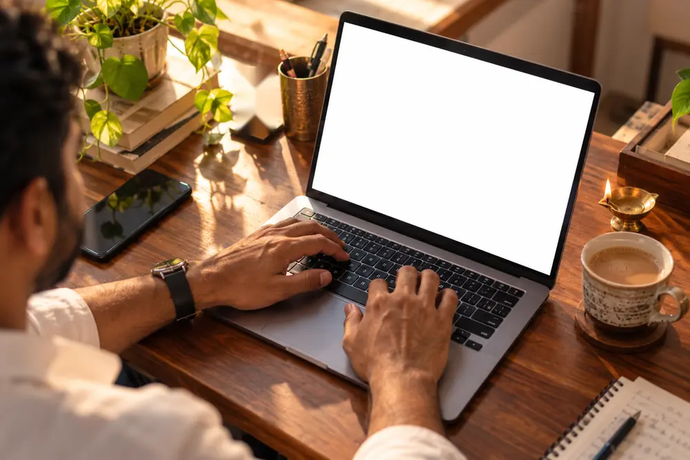Business owner checking appointments booked by Orra on a laptop